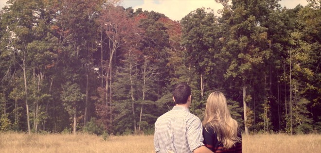 Ridings couple in front of an open lot